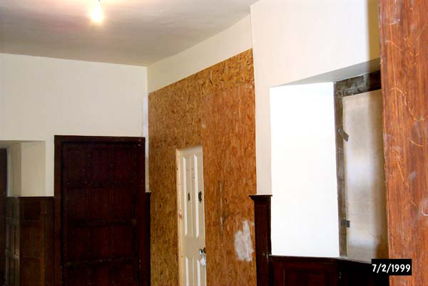 A modern partition across the entrance to the Great Gallery, prior to restoration work