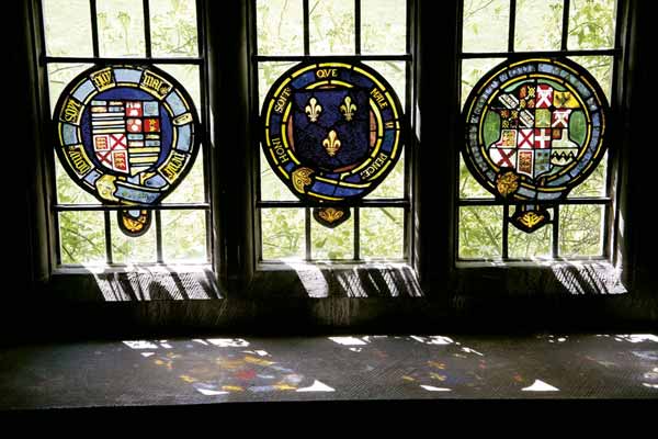 Armorial stained glass, circa 1665, on the Jacobean staircase